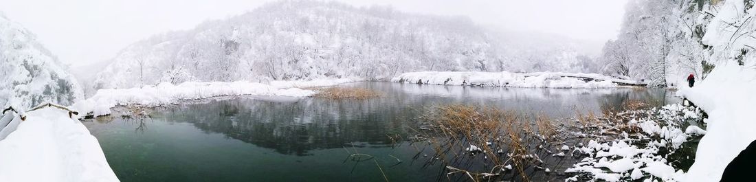 Scenic view of frozen lake against sky