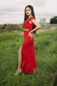 Young woman standing on field