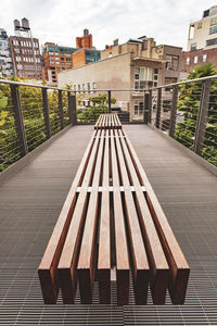 High angle view of footpath amidst buildings in city