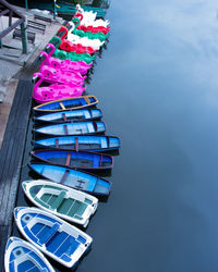 Rowing boats and pedelos tired up on river avon