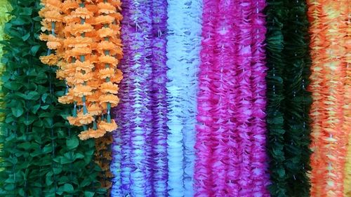 Full frame shot of artificial floral garlands