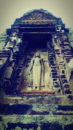 Low angle view of statue against sky