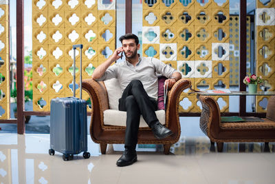 Portrait of man sitting on chair