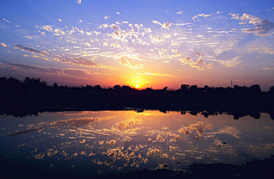 Scenic view of sunset over river