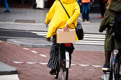 Rear view of women walking on street