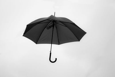 Low angle view of umbrella against sky