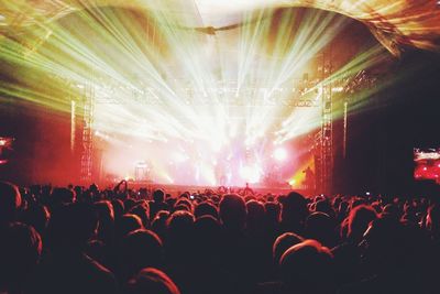 Rear view of people enjoying music concert