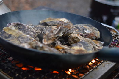 Close-up of oyster in cooking pan