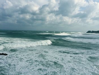 Scenic view of sea and cloudy sky