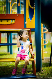 Low angle view of girl playing on playground