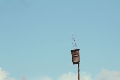 Low angle view of street light against clear blue sky