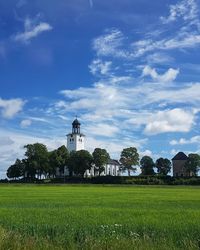 Protestant church on field against sky