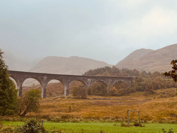 Viaduct against mountains