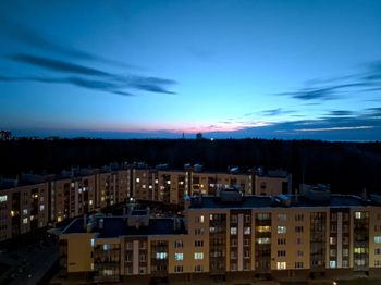 High angle view of buildings against sky at sunset