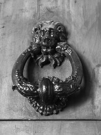 Close-up of sculpture on door