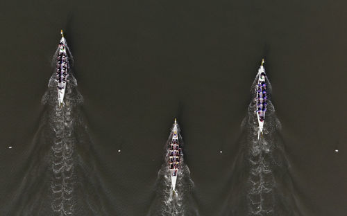 Aerial view of rowboats on lake