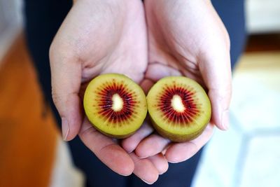 Close-up of hand holding fruit