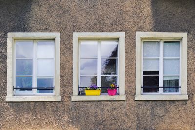 Three windows on a building