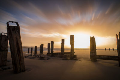 Scenic view of beach against sky during sunset