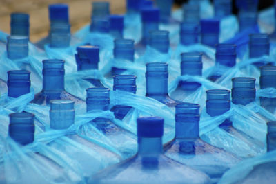 Big blue plastic water bottle necks