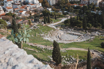 High angle view of trees and buildings in city