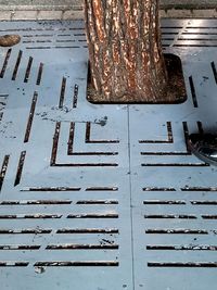 High angle view of manhole on footpath