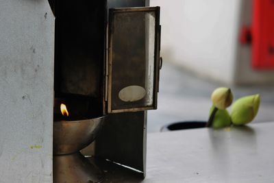 Close-up of electric lamp on table