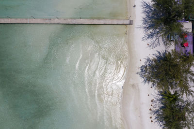 High angle view of sea by trees