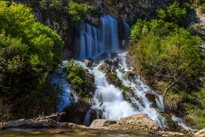 Scenic view of waterfall in forest