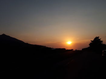 Scenic view of silhouette landscape against sky during sunset