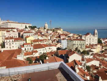 High angle view of townscape against blue sky