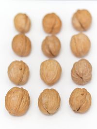 Close-up of macaroons over white background