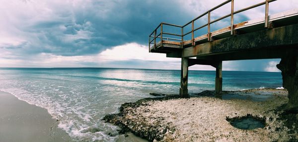 Scenic view of sea against cloudy sky