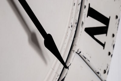 High angle view of metal railing against white wall