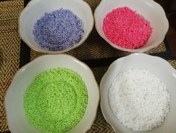 High angle view of candies in bowl on table