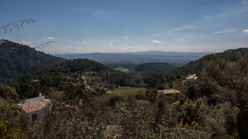 Scenic view of landscape and mountains against sky