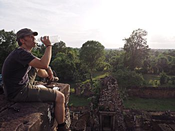 Portrait of man holding camera