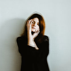 Young woman with eyes closed