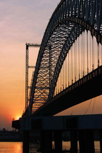 Silhouette of bridge at sunset