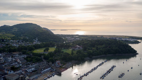 High angle view of river by buildings against sky