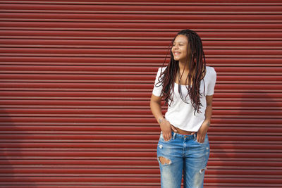 Young woman with dreadlocks on the street