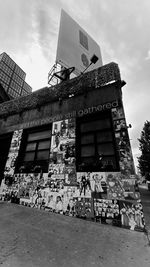 Low angle view of abandoned building against sky