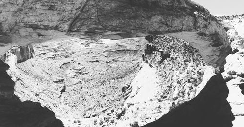 Low angle view of rock formation against sky