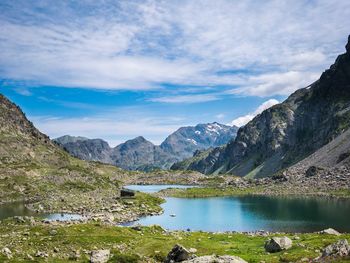 Scenic view of lake and mountains against sky