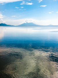 Scenic view of sea against blue sky