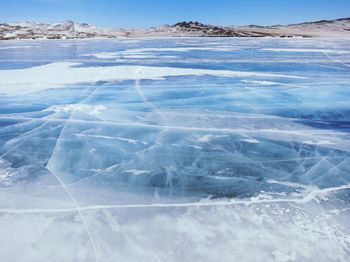 Scenic view of frozen lake against sky