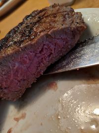 High angle view of meat in plate on table