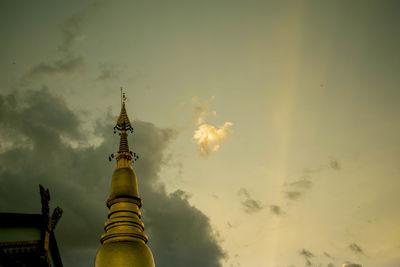 Low angle view of a building against cloudy sky