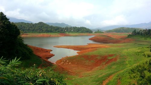 Scenic view of landscape and mountains against sky