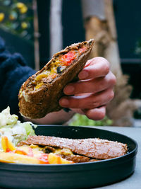 Close-up of hand holding food